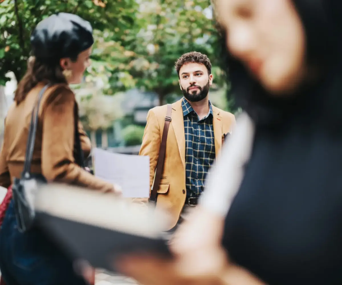 Business professionals engaged outside