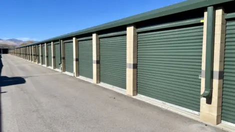 Green doored storage units outside at the Towne Storage Redwood Storage Facility