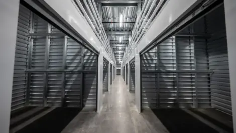 Hallway of open storage units, indoor storage units Towne Storage Southern