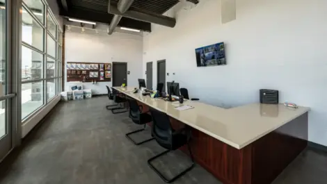 Office area, seating, security tv and cameras, storage supplies at Towne Storage Southern