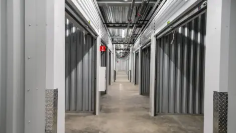 Clean, hallway view of large storge units, all open Towne Storage-Clinton