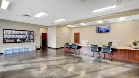 Office area at Towne Storage Deer Springs, large, open, clean area with a wall of supplies.