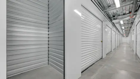 Inside storage unit and a view of a row of storage units at Towne Storage MLK
