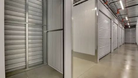 Inside of storage unit looking into the hallway of storage facility at Towne Storage Sunset