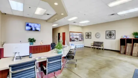 Office area at storage facility at Towne Storage Buffalo. Supplies on the wall, security tv on wall.