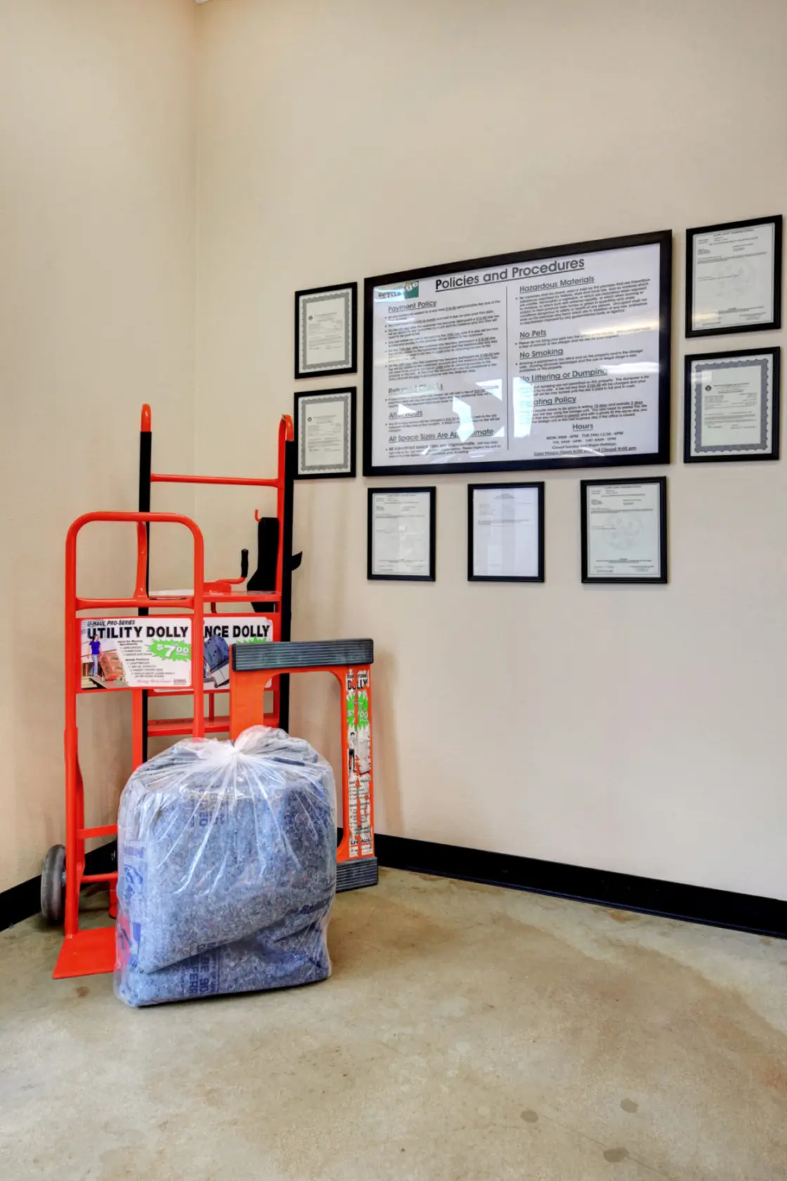 Dollies and policies hung up on the wall at Towne Storage Buffalo