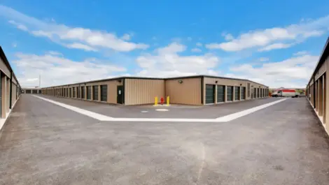 View of outdoor storage units with U-Haul truck at Towne Storage Buffalo