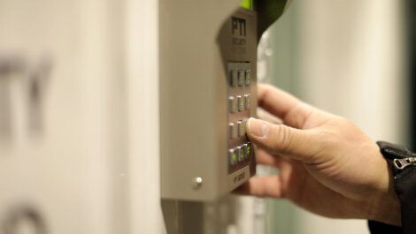 Hand on a keypad at the Towne Storage State Street Storage Facility