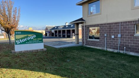 Main sign and parking lot at the Towne Storage Monarch Meadows Storage Facility