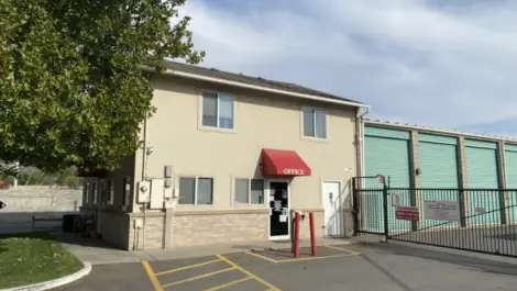Store front with security fence Towne Storage Woods Cross