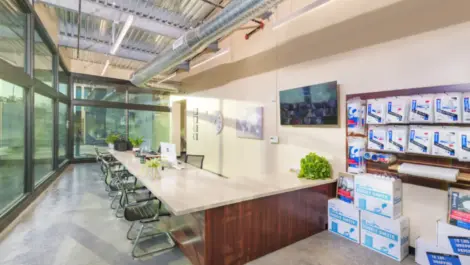 Towne Storage Broadway office area with wall of storage supplies