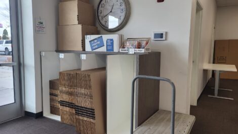 Boxes for sale and a moving dolley at the Towne Storage Urban Edge Storage Facility