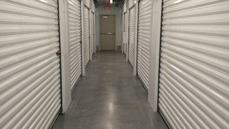 Interior hallway of a storage facility with roll up doors
