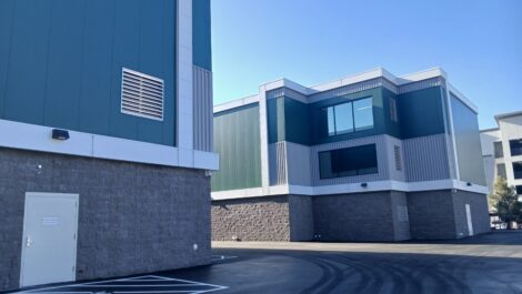 Two blue buildings of a storage facility