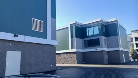 Two blue buildings of a storage facility