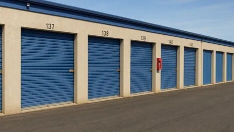 Mead Self Storage up close of blue doors to outdoor, drive up storage